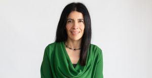 The Children's Commisioner for Wales, Rocio Cifuentes looking straight at the camera smiling.