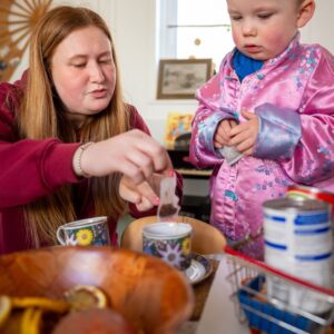 An adult doing activities with a child