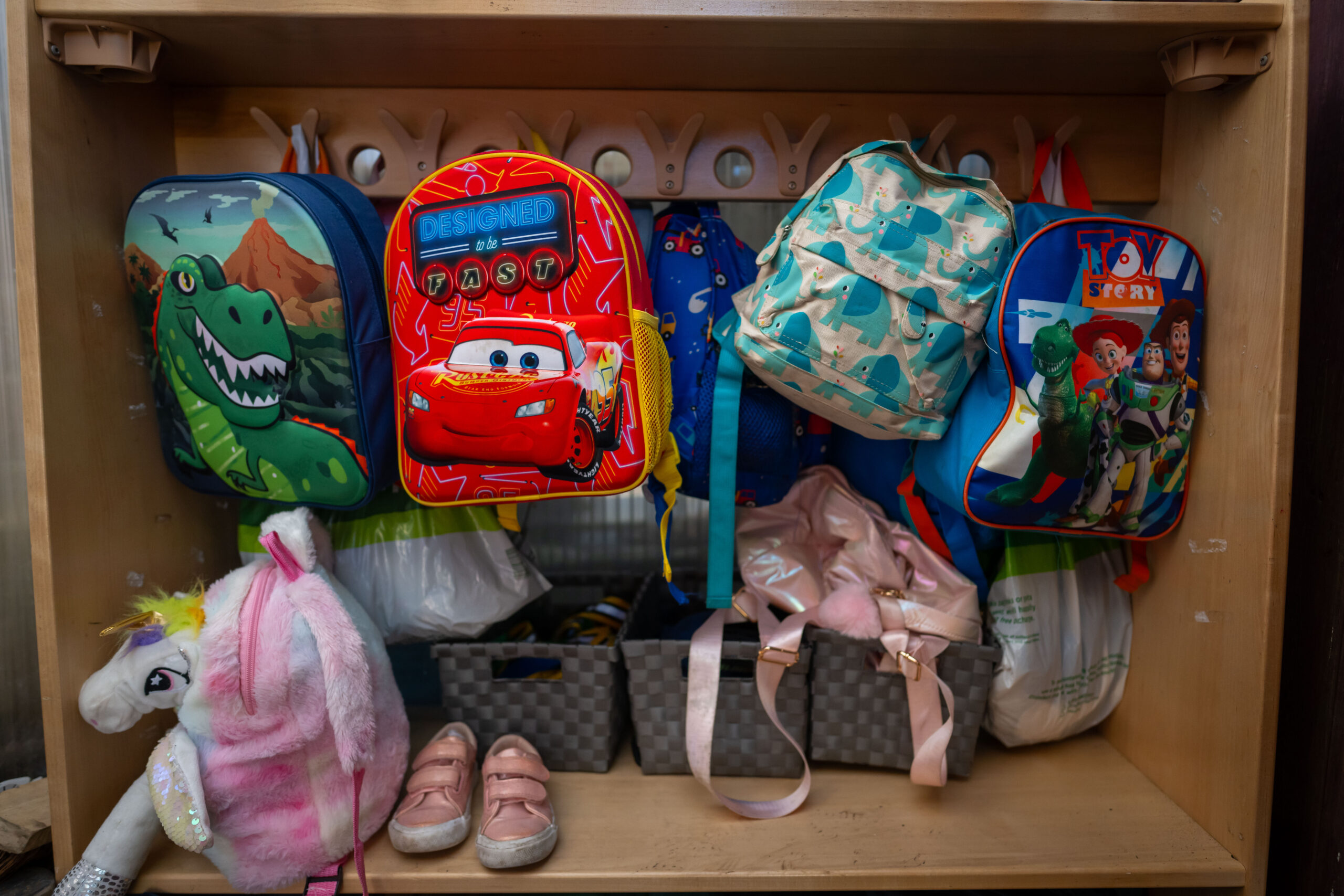 school bags on pegs