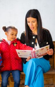 The Children's Commissioner reading with a child